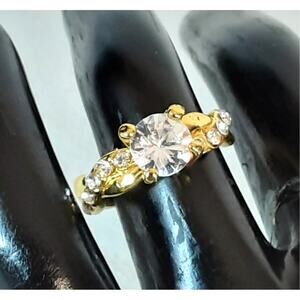 Eye-Catching Faux Diamond Ring With Clear Stones on Gold Tone Infinity Band